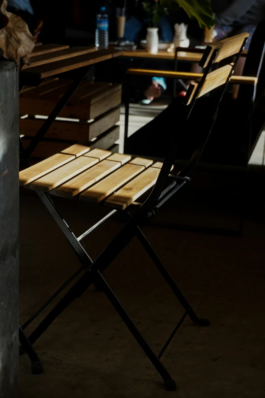 wooden folding chairs sitting next to each other