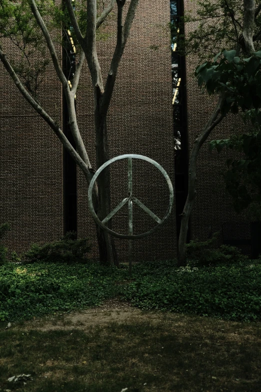 the peace sign in front of a brick building