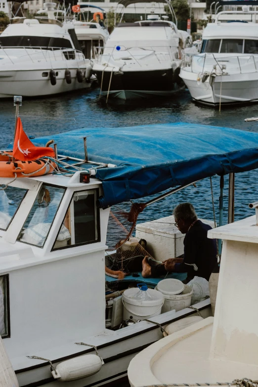 a group of people sitting on the back of a boat