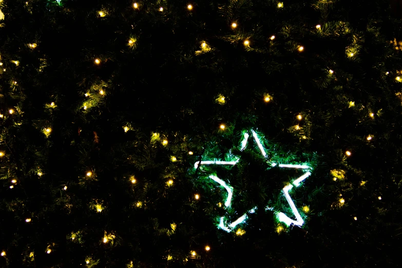 a large green star on the side of a building