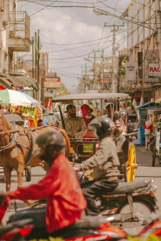 an older man riding a horse drawn cart down the road