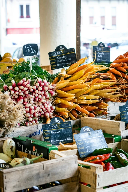 a bunch of vegetables are for sale at an outdoor market