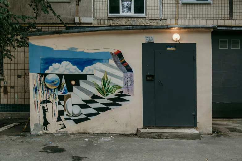 a painted wall with a blue door in front of it