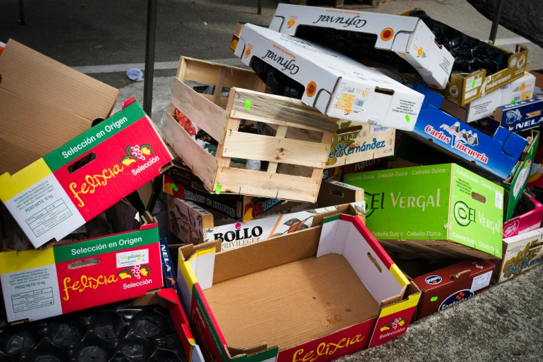 a pile of boxes sitting on the side of the road