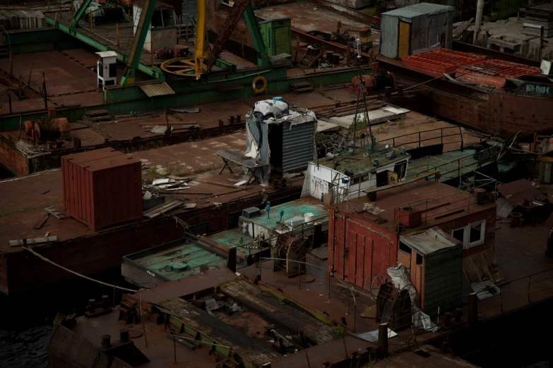 an overhead view of a factory with workers and their trucks