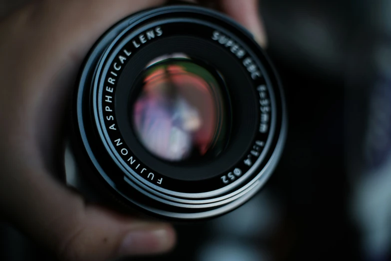 a person holding a camera in their hand