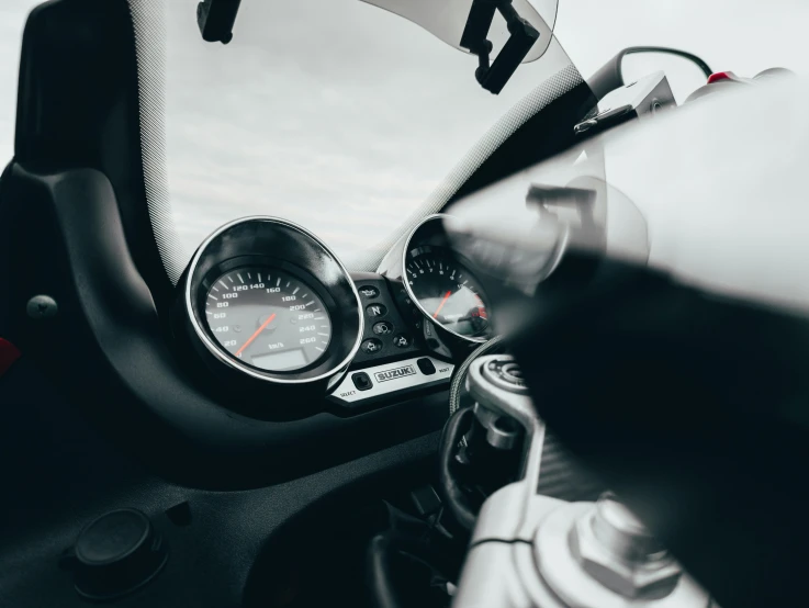 a close up of a motorcycle dashboard and meter