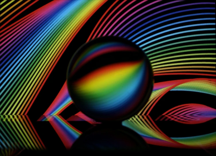 a sphere and a multi colored wave in a multicolored image