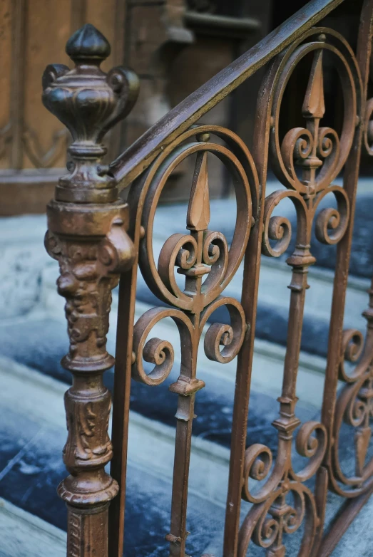 a wrought iron hand rail and balconies