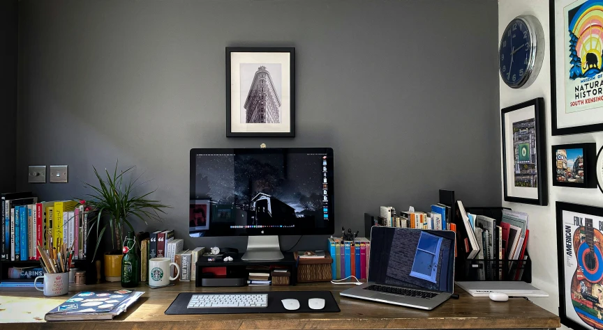 a laptop computer is on a wooden desk