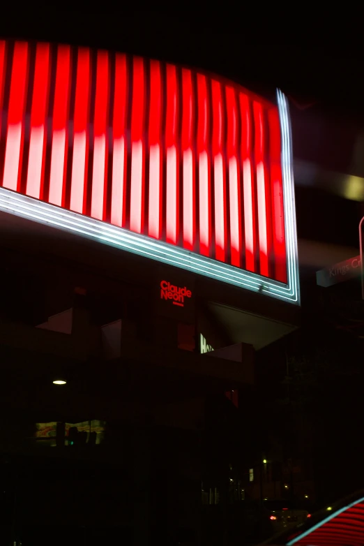 the city's bright neon red sign is lit up