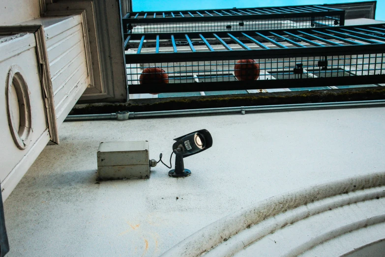 a street light sitting next to a camera