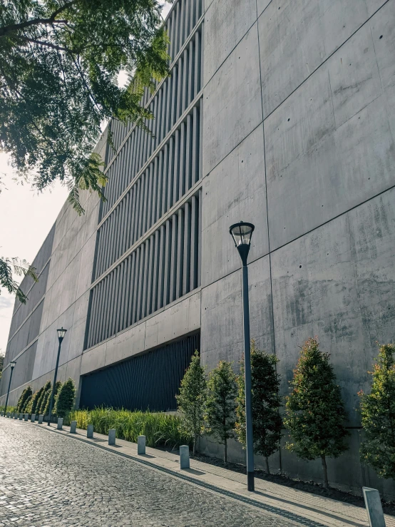 a large building with a street lamp on the corner