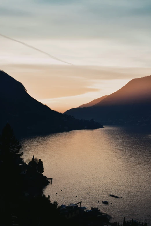 water and mountains with small boats in the ocean