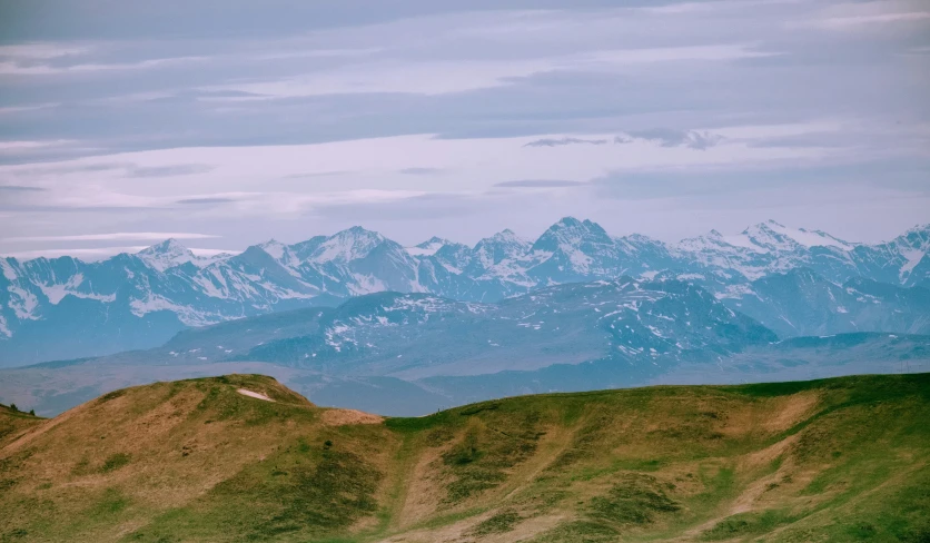 a scenic view of the mountains from a distance