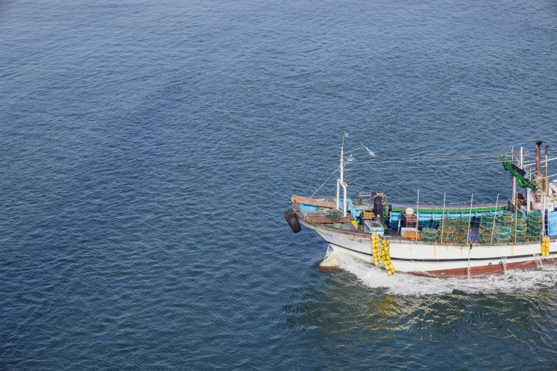 an old fishing boat is out on the water