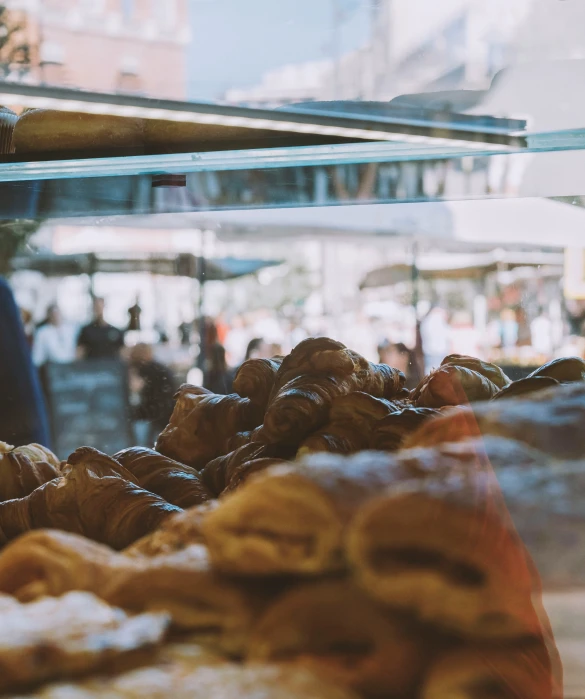 pastries sitting in bins on display next to each other