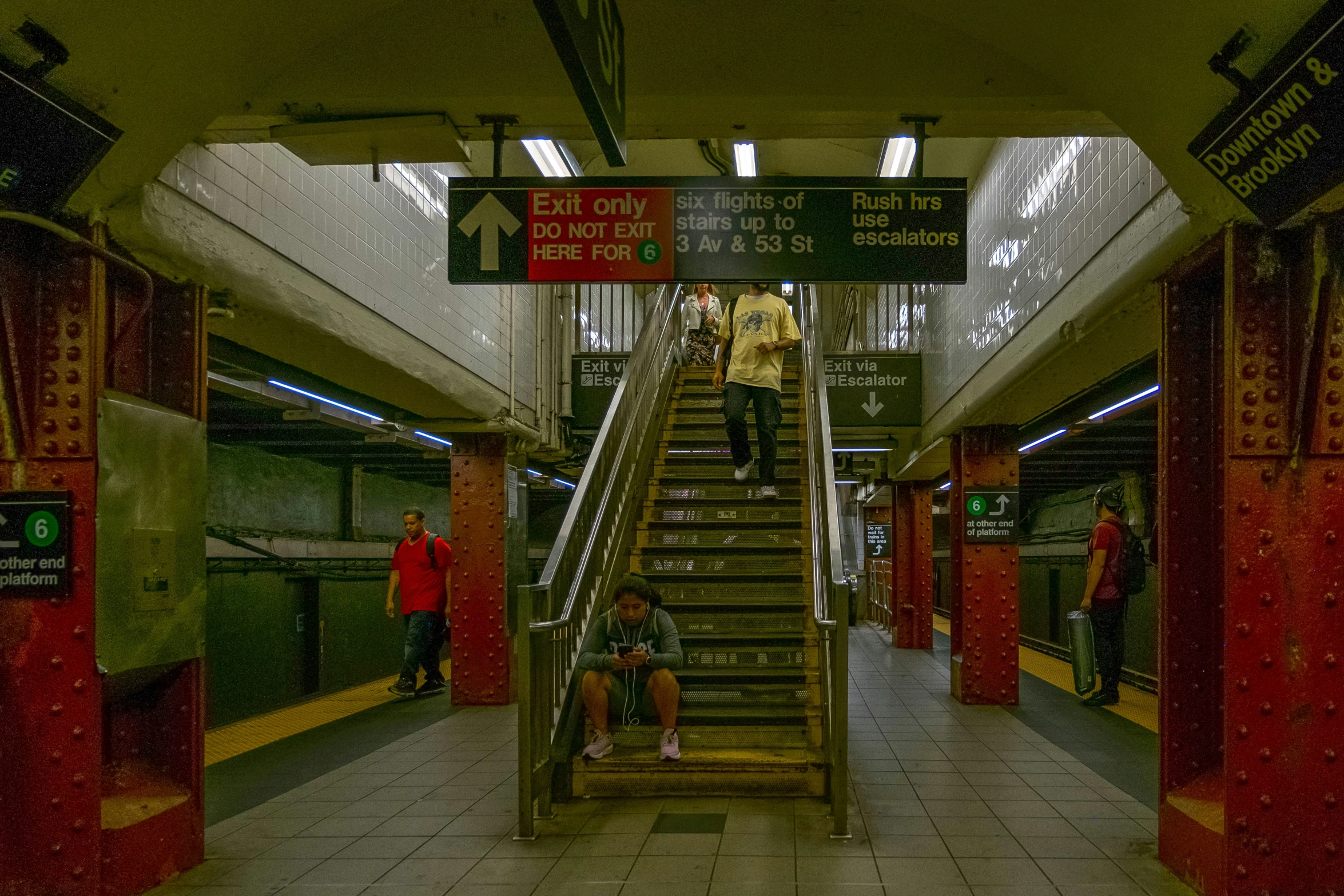 people are climbing down and down the stairs