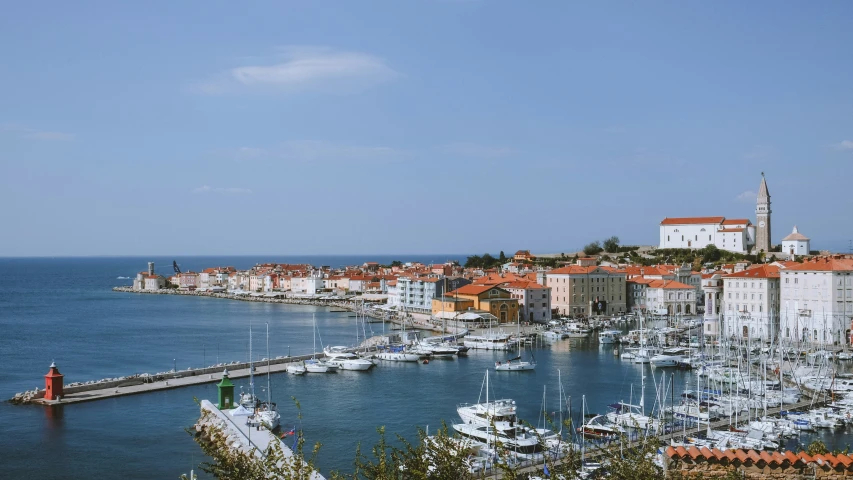 view of the city and harbor, with yachts, ships, and piers