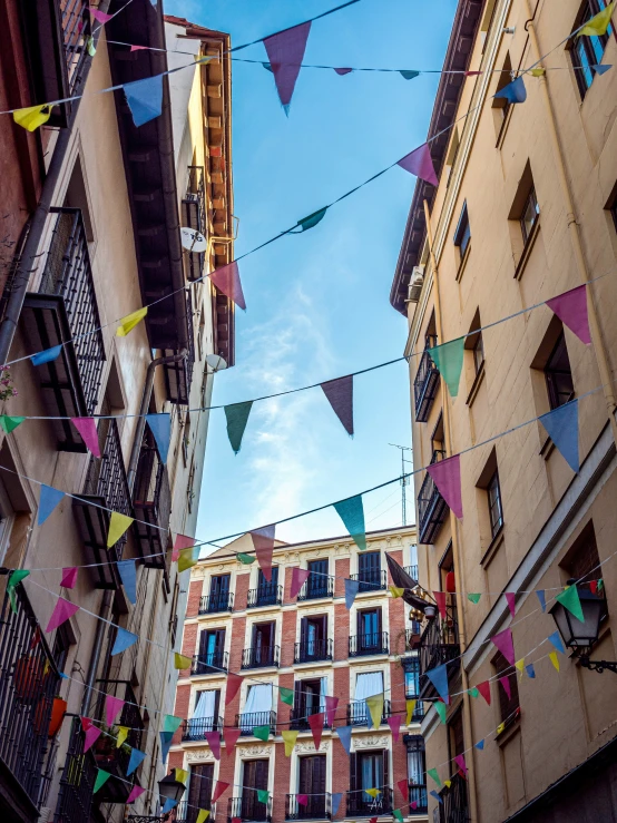 colorful decorations hanging off the side of buildings