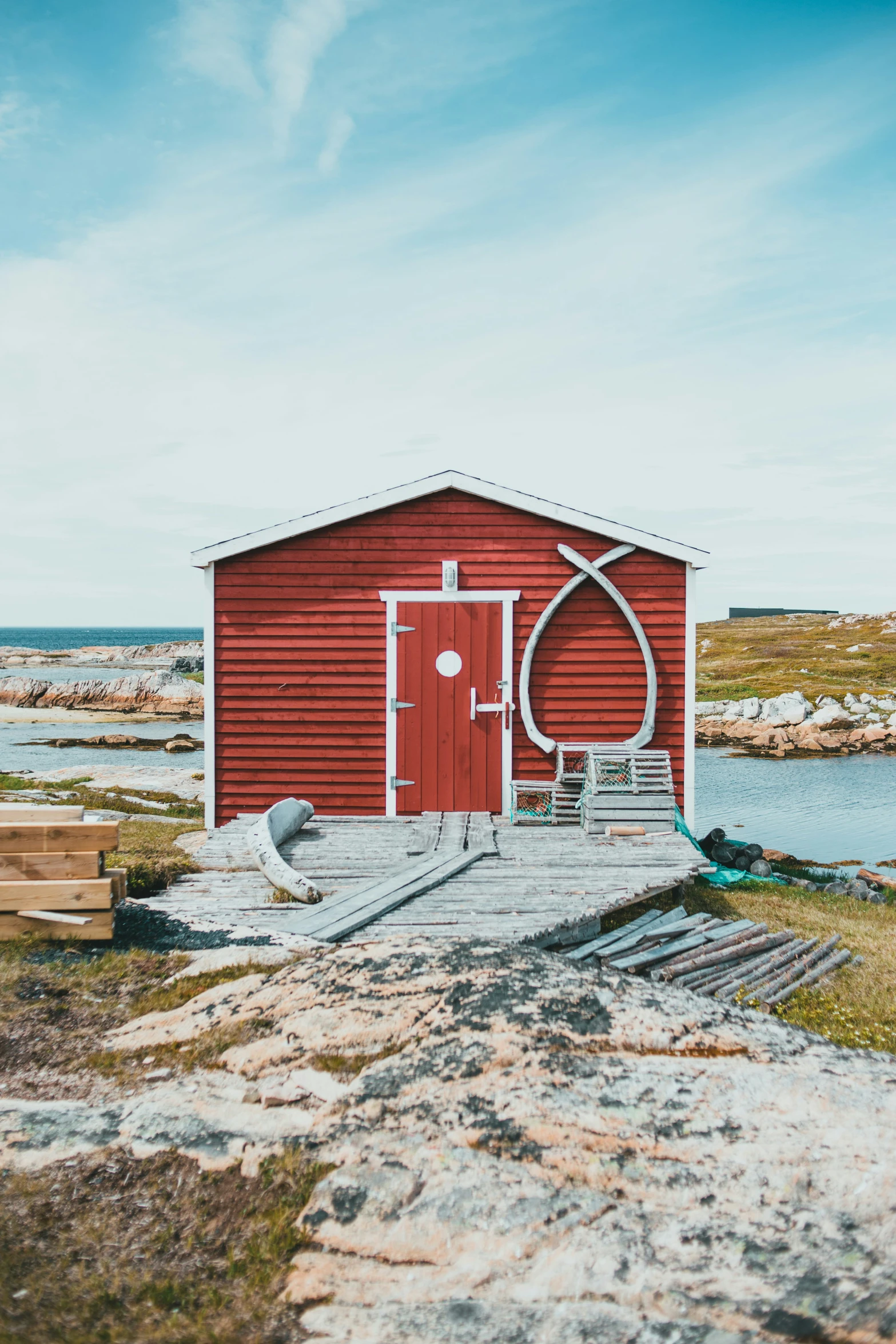 a red building with a long wooden door