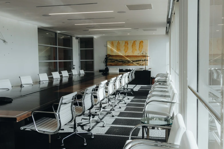 an office meeting room setting with chairs and desks