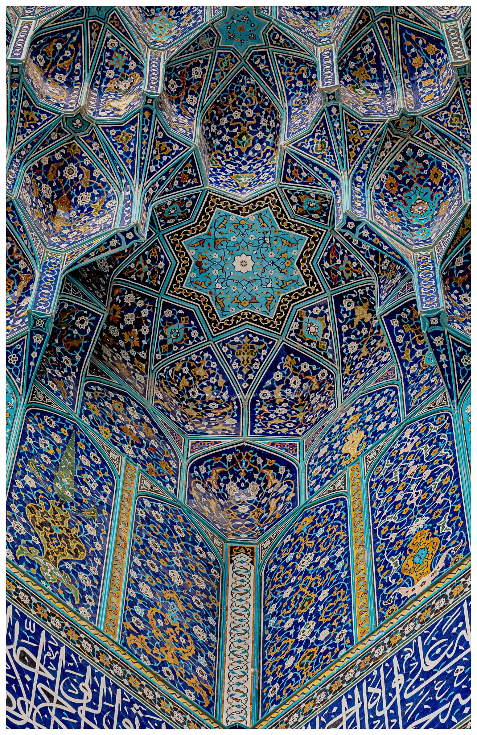 a blue, ornate wall with an intricate pattern