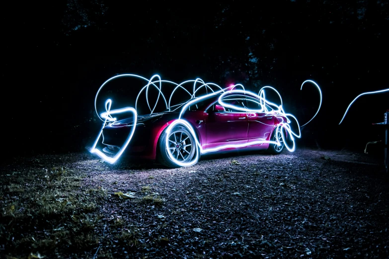 the car is sitting in the dark with lights