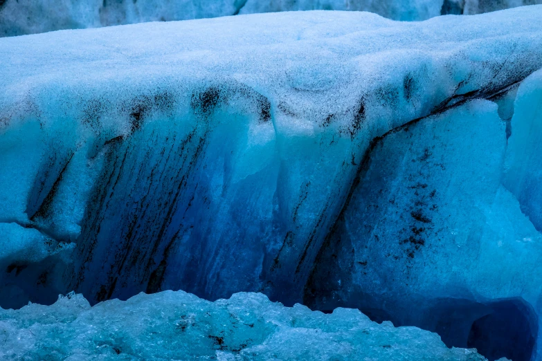 an ice - coated piece of rock that looks like a glacier