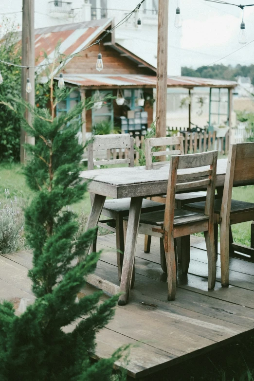 a table that is on some wood in the ground