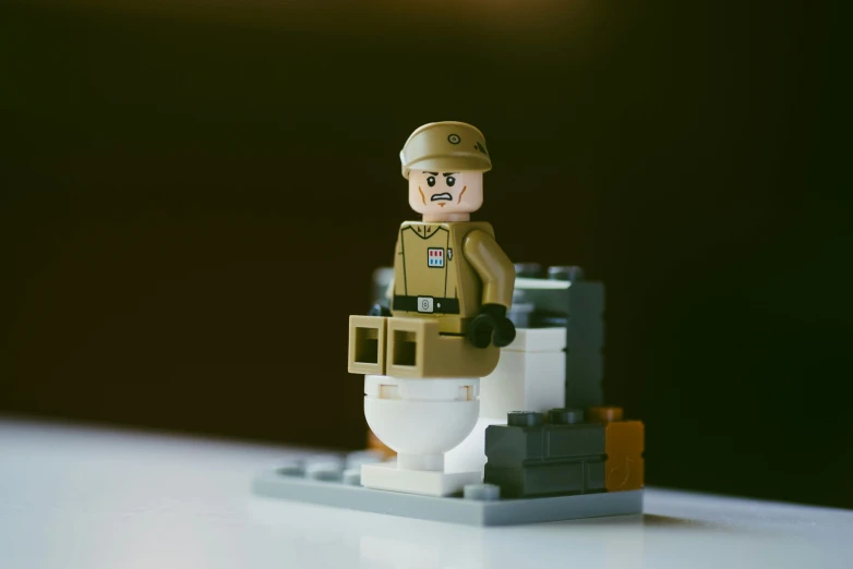 lego toy soldier standing outside on an outdoor table