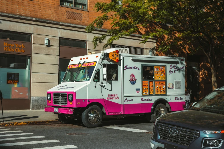 a food truck sitting on the side of a road