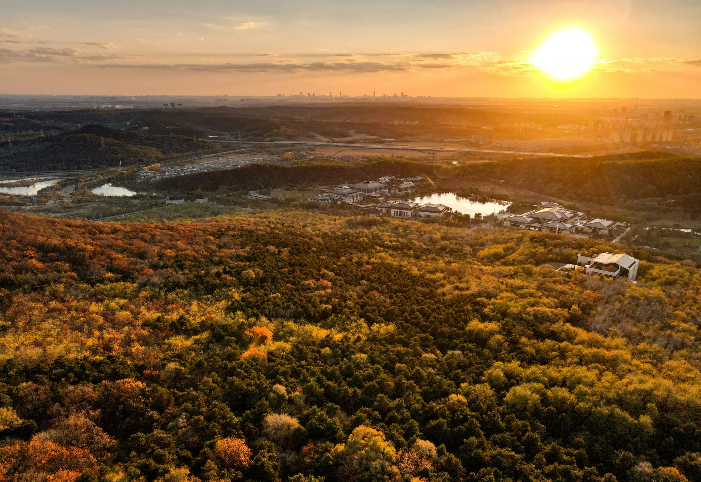 a beautiful view with sun setting over a valley