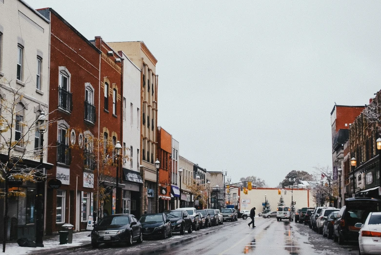 a city street is covered with snow during a snowy day