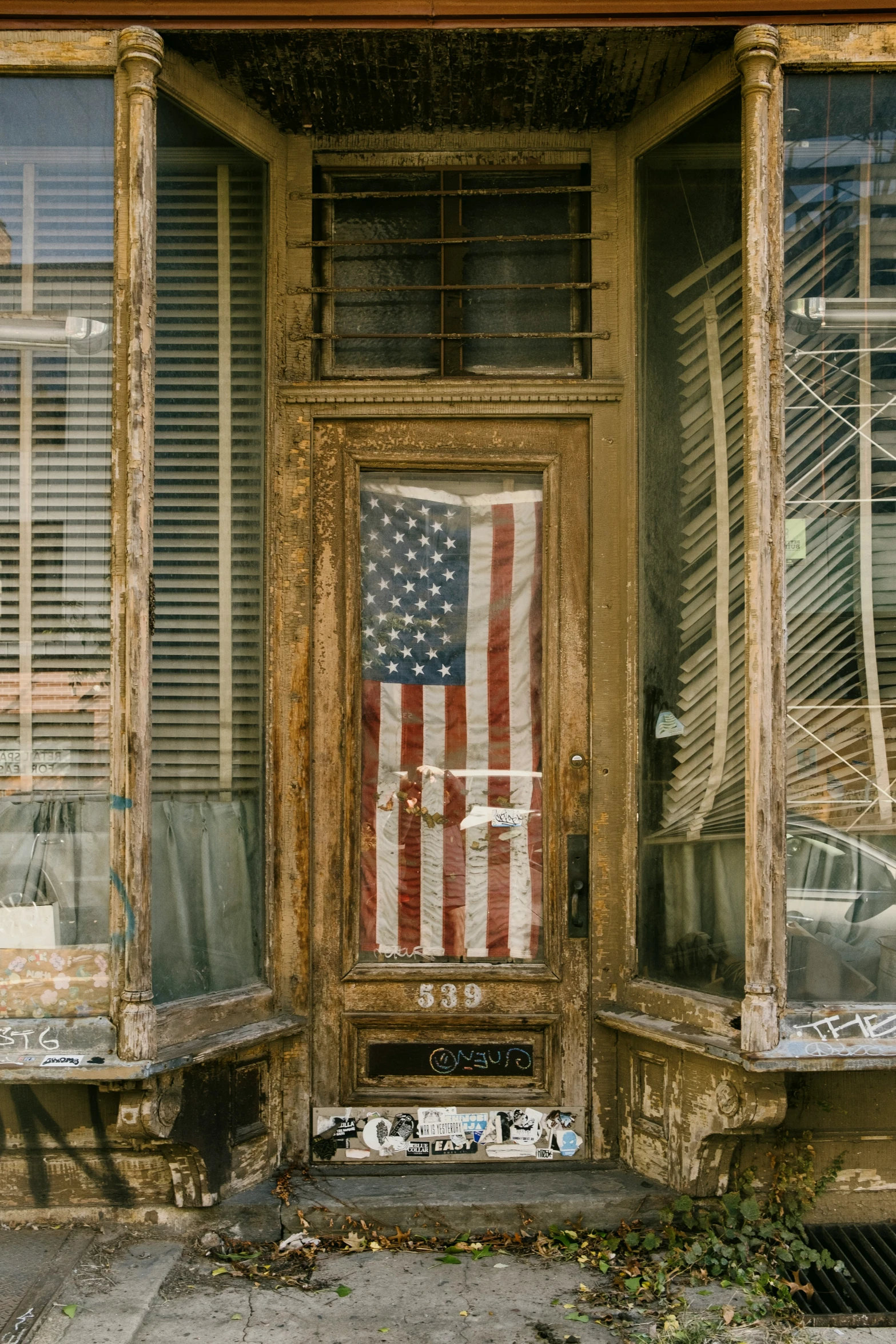 a patriotic door is shown with two windows