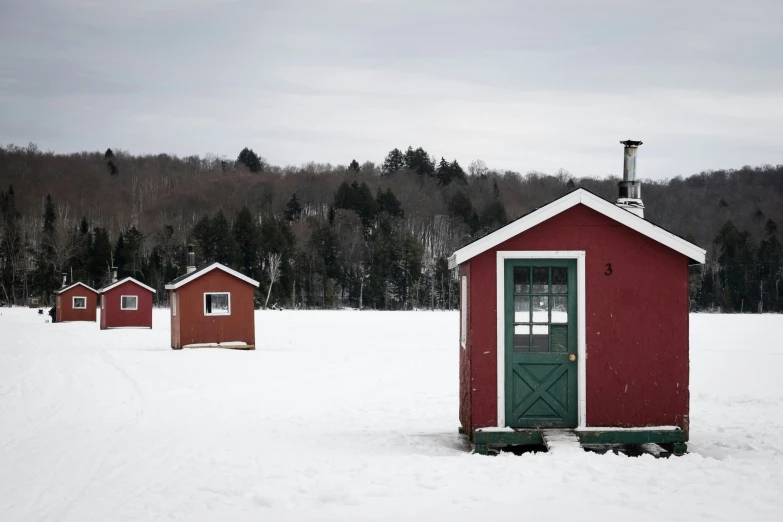 the red buildings are all covered in snow