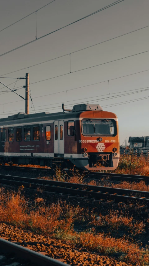 a passenger train that is stopped on the tracks