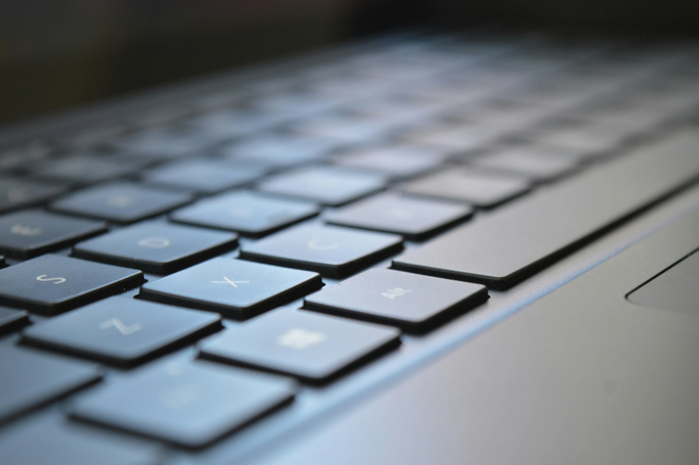 an apple mac computer keyboard with all its keys missing