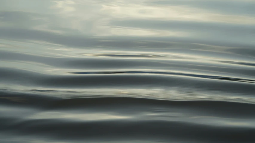 an image of sky and water ripples in the ocean