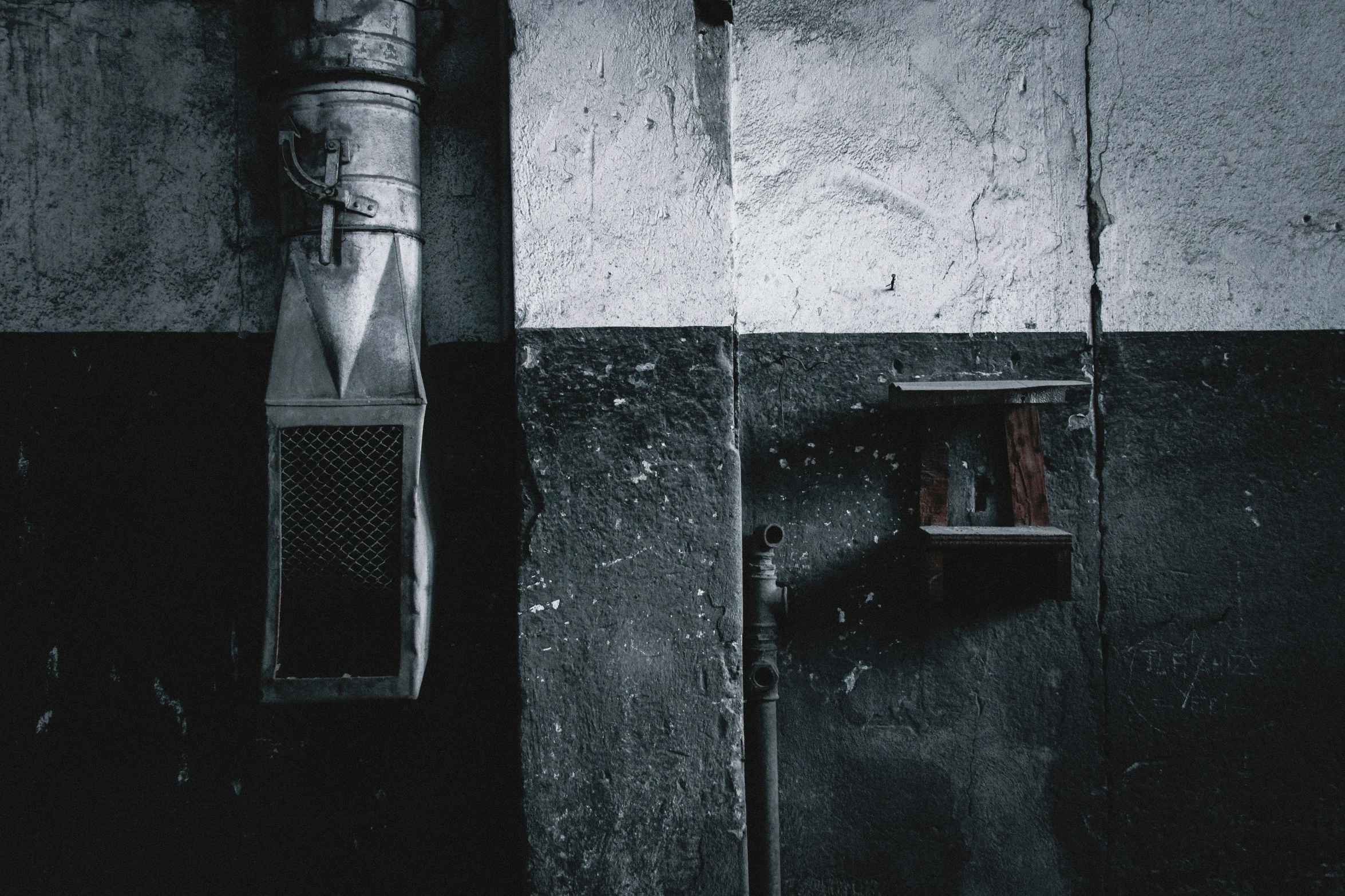 a black and white po of a door that has some kind of water bottle on it