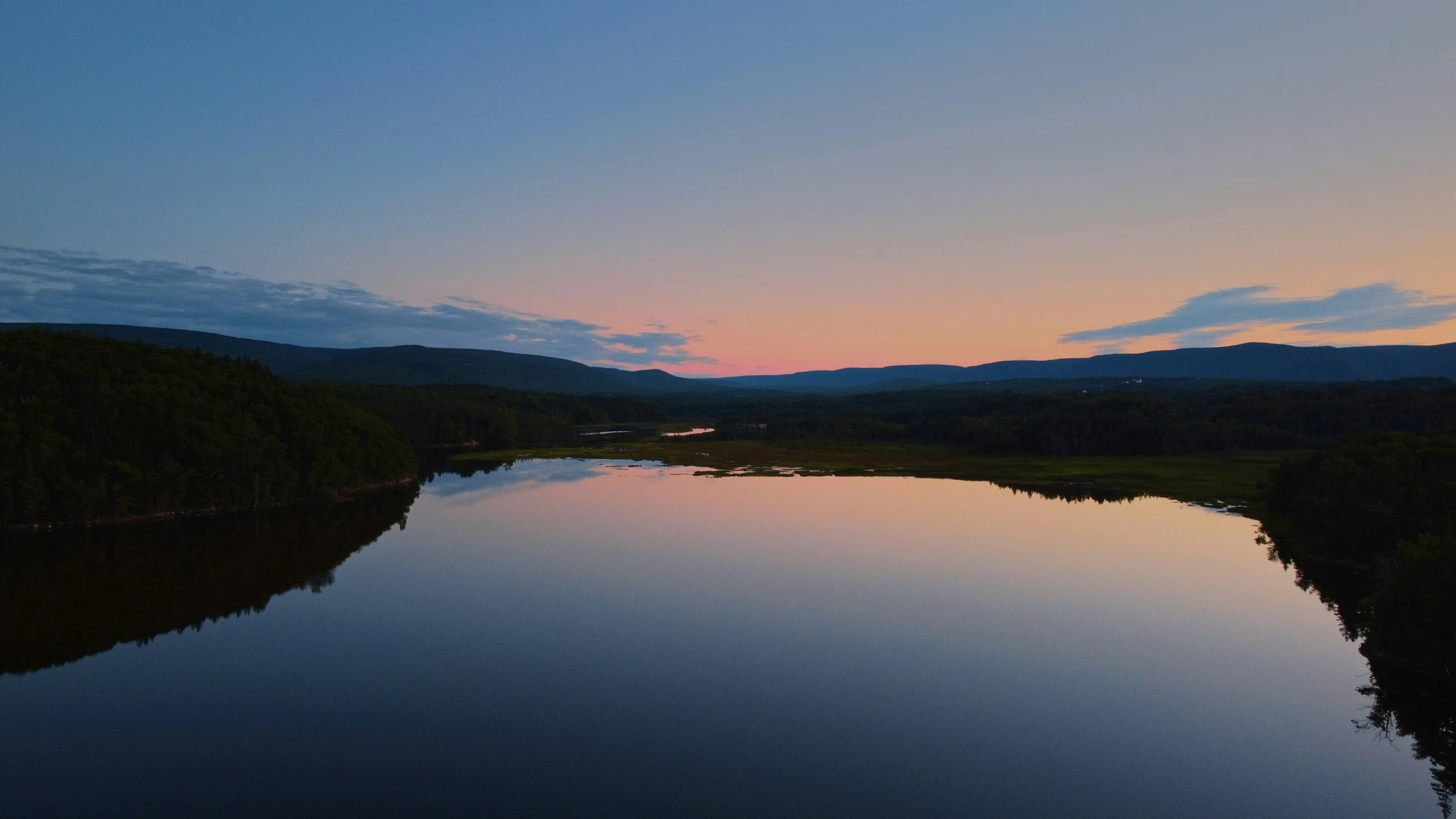 a large body of water with trees in the background