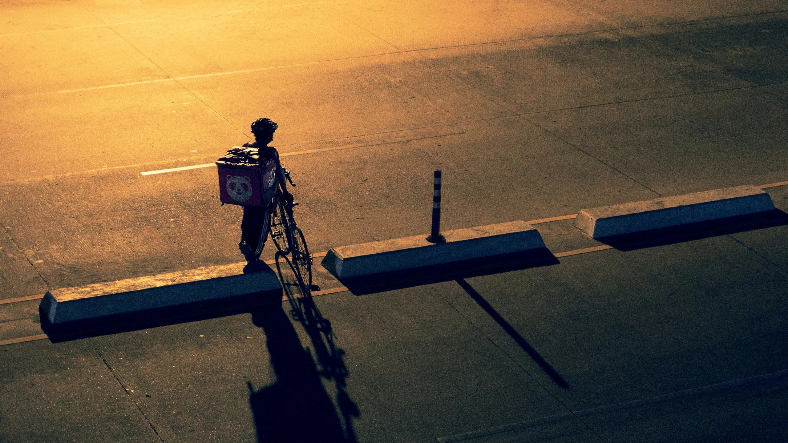 there is a person riding a bike on the street