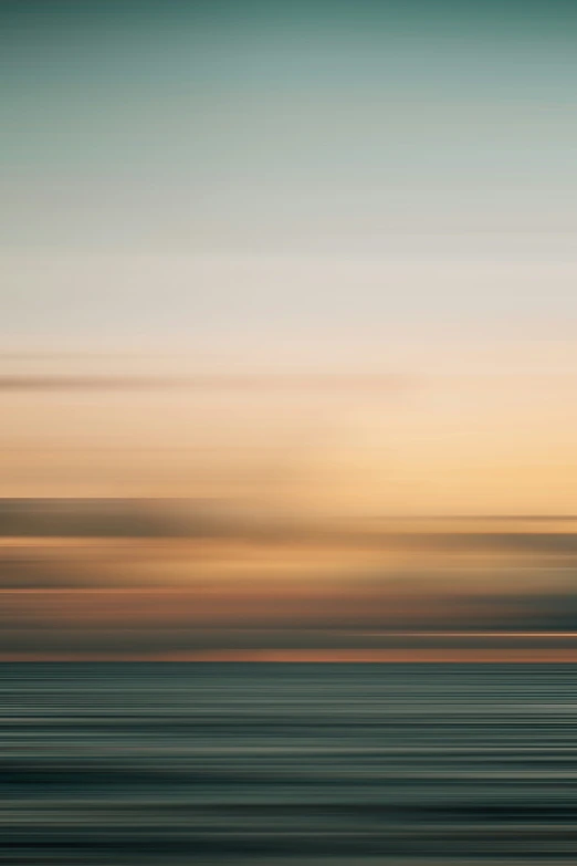 a boat is sailing in the sea near the beach