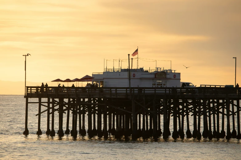 there is a boat that is docked near the pier