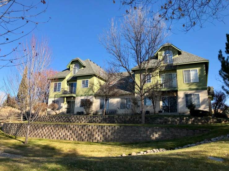 a house with an interesting fence in front of it