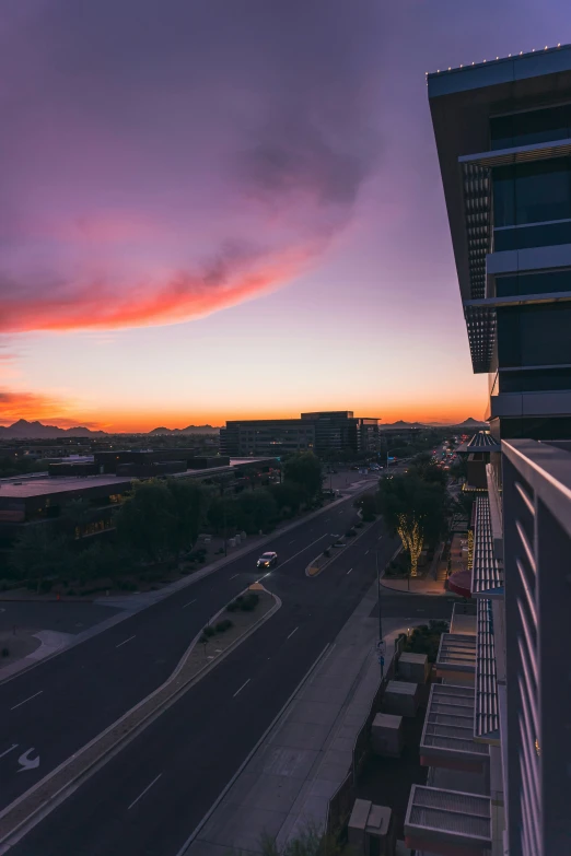 the view out a building window overlooking a highway