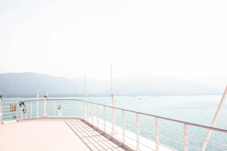 the railing is on the cruise ship next to the water