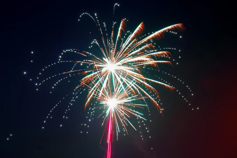 a bright fireworks show being viewed through the camera lens