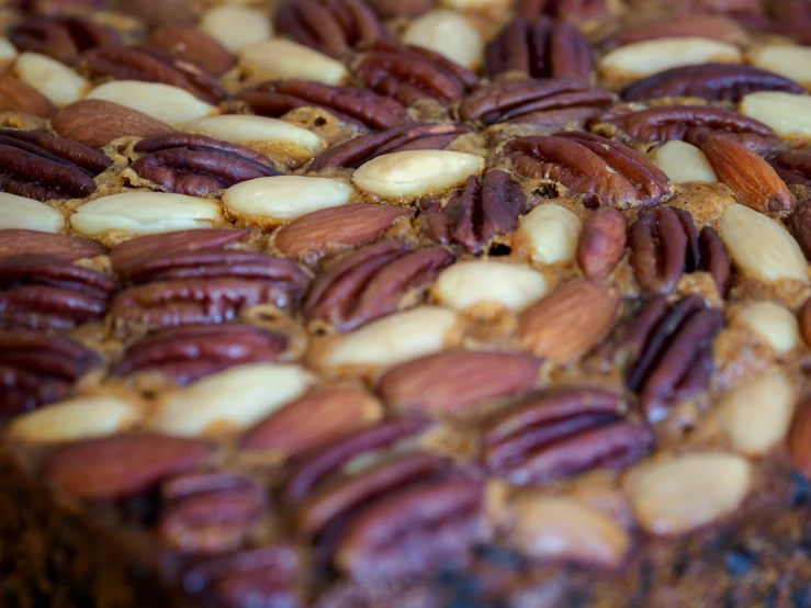 several nuts are placed on top of a cake