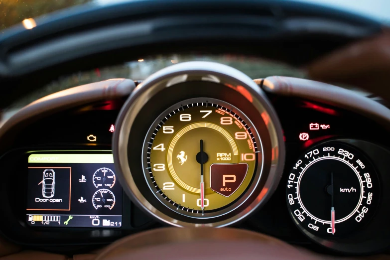 dashboard of a car with illuminated meter